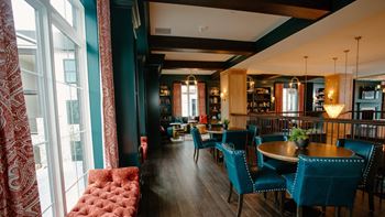 a dining room with blue chairs and a red couch at Dalton, Ohio, 43081